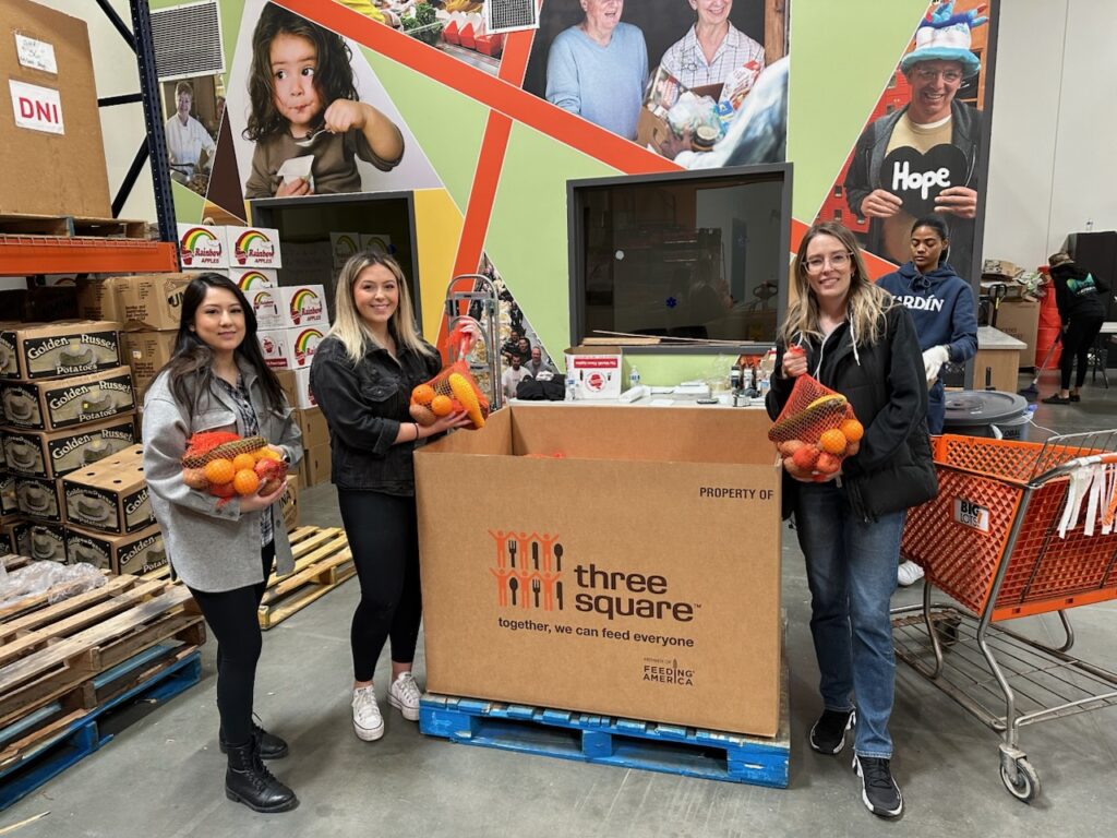 LP Insurance staff volunteer their time at	Three Square Food Bank 